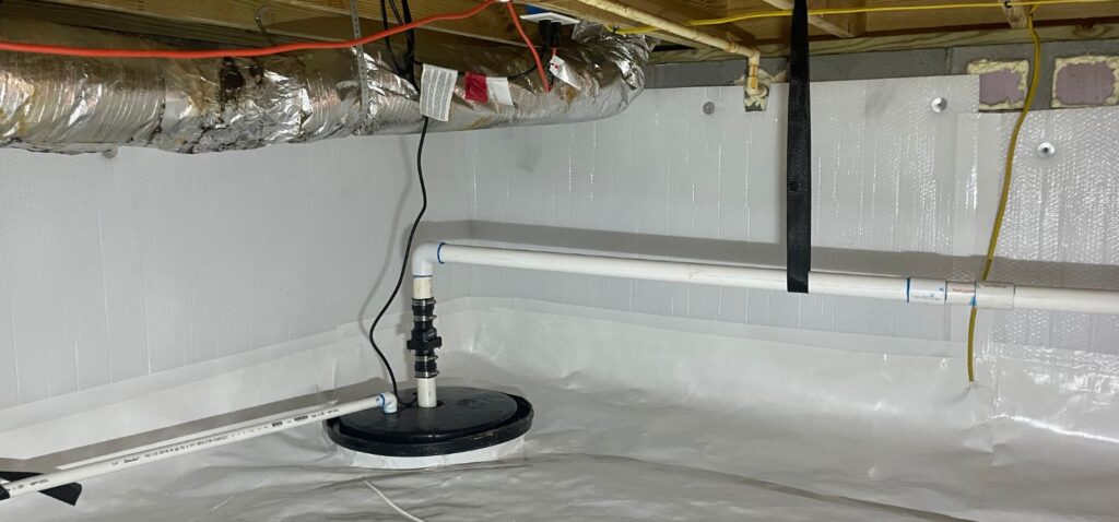 A professionally encapsulated crawl space with a white vapor barrier, sump pump system, insulated ductwork, and visible utility lines, showcasing moisture control and foundation protection.
